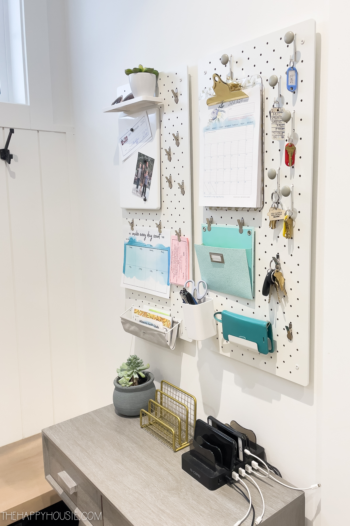 Pegboard wall organizers setup to help keep your family organized.