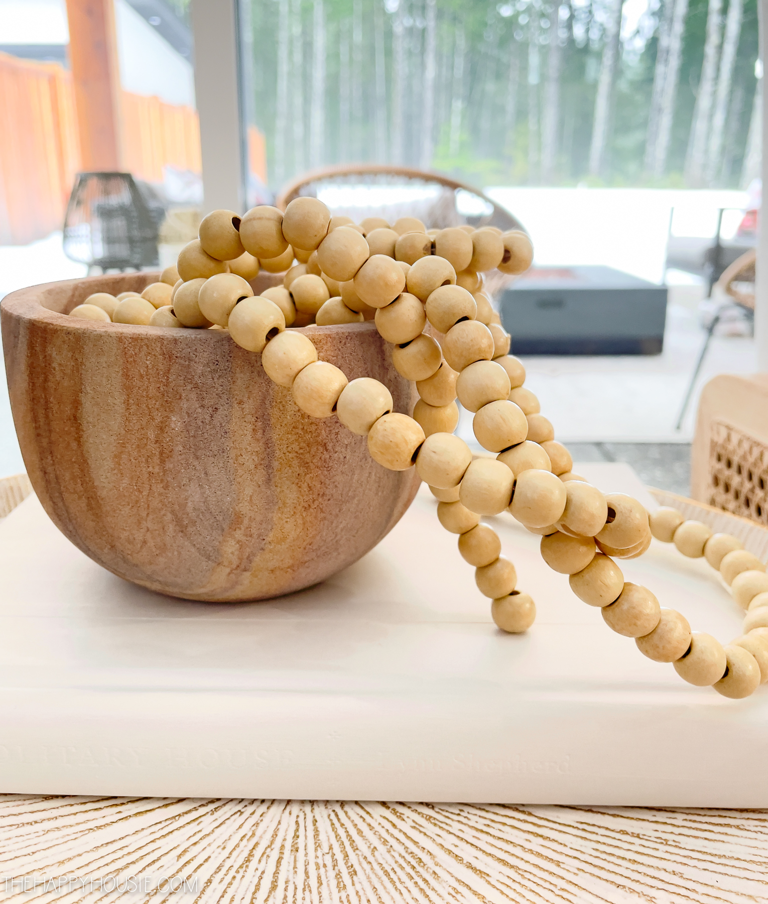 Wooden beads in a wooden bowl.