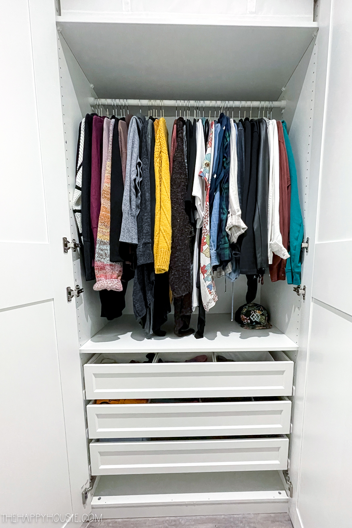 bedroom organization ideas featured in an Ikea Pax wardrobe system
