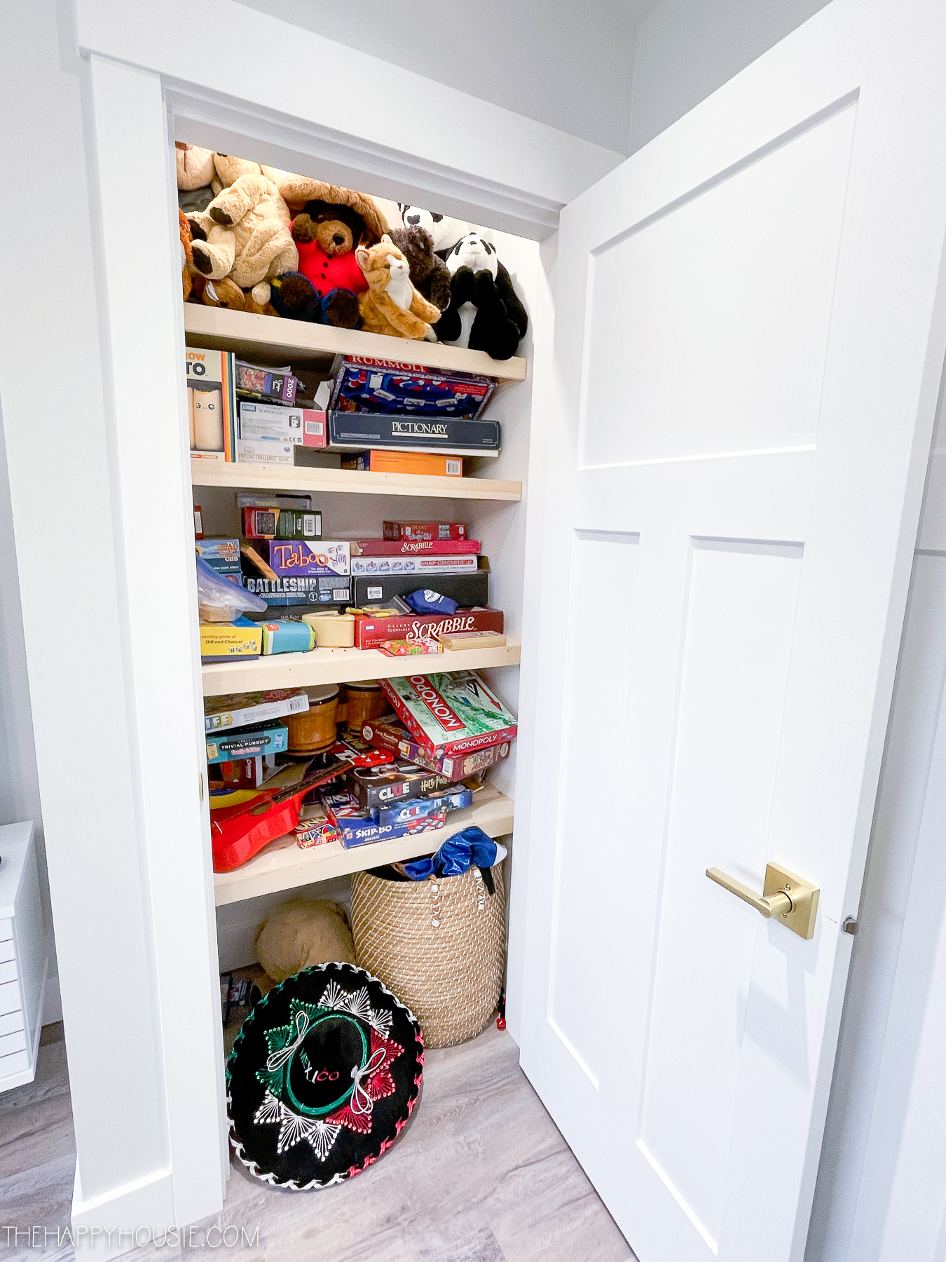 closet with wooden shelves in a playroom used for playroom organization and storage
