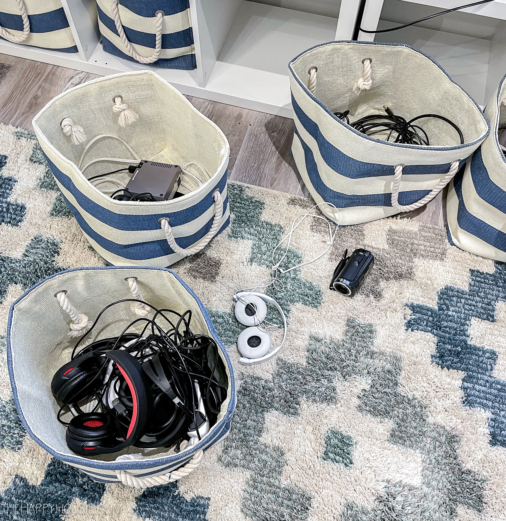 bins used to store electronic items in a playroom family room