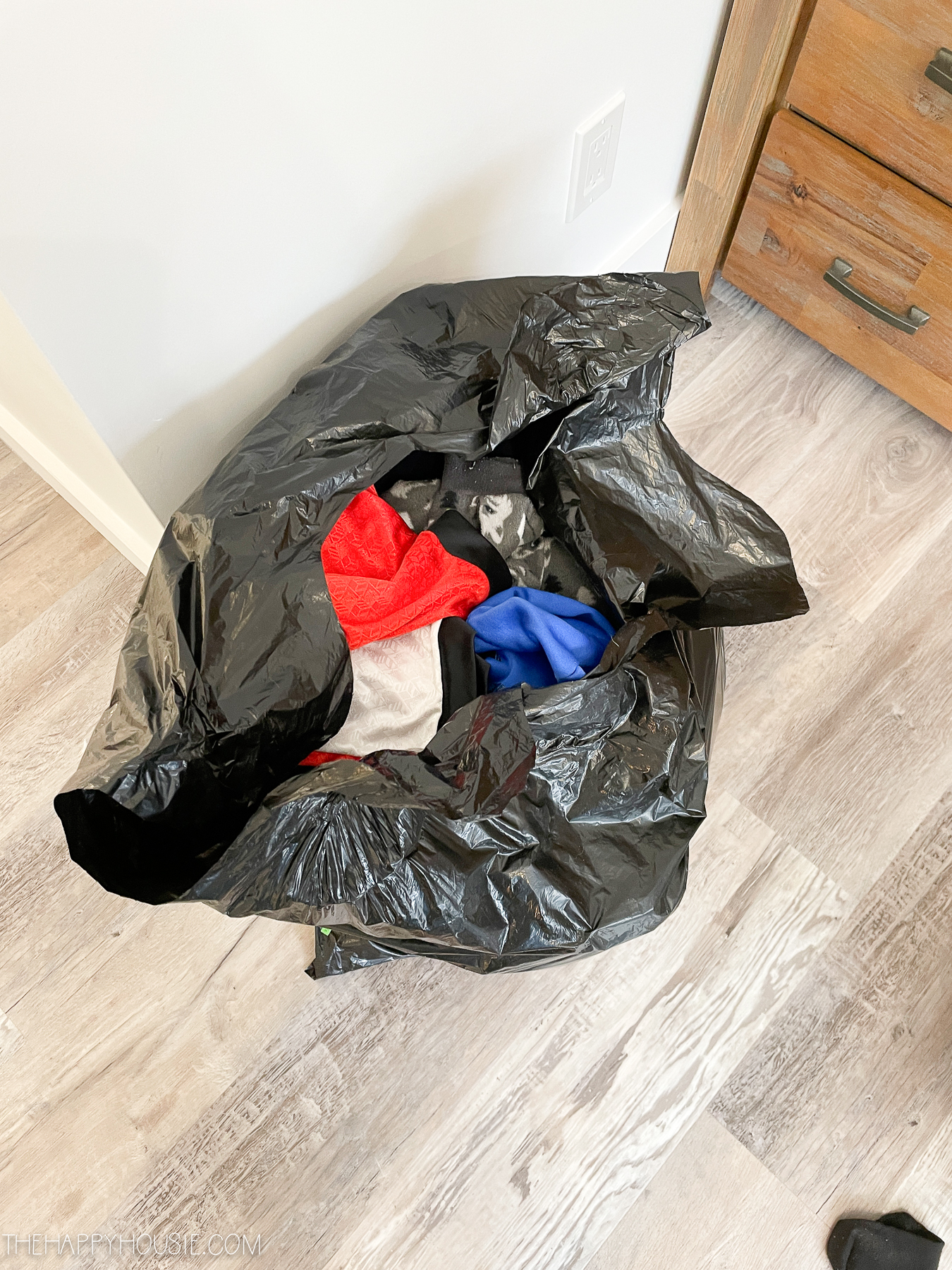 room organization ideas picture of garbage bag full of clothes ready to donate