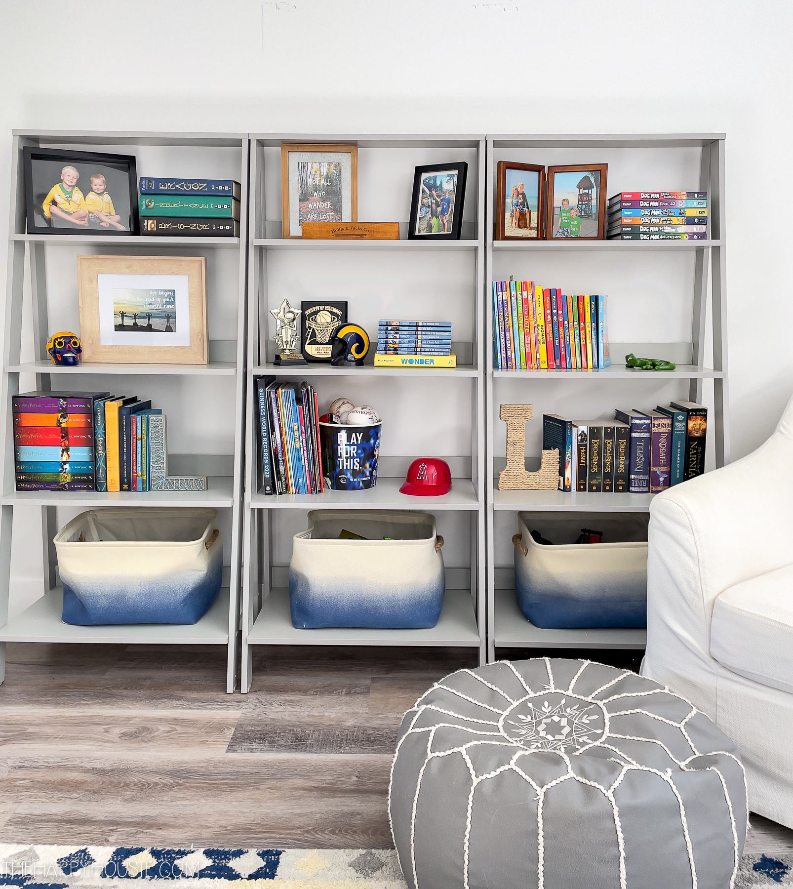 room organization ideas picture of three ladder style bookcases after being organized in teen bedroom
