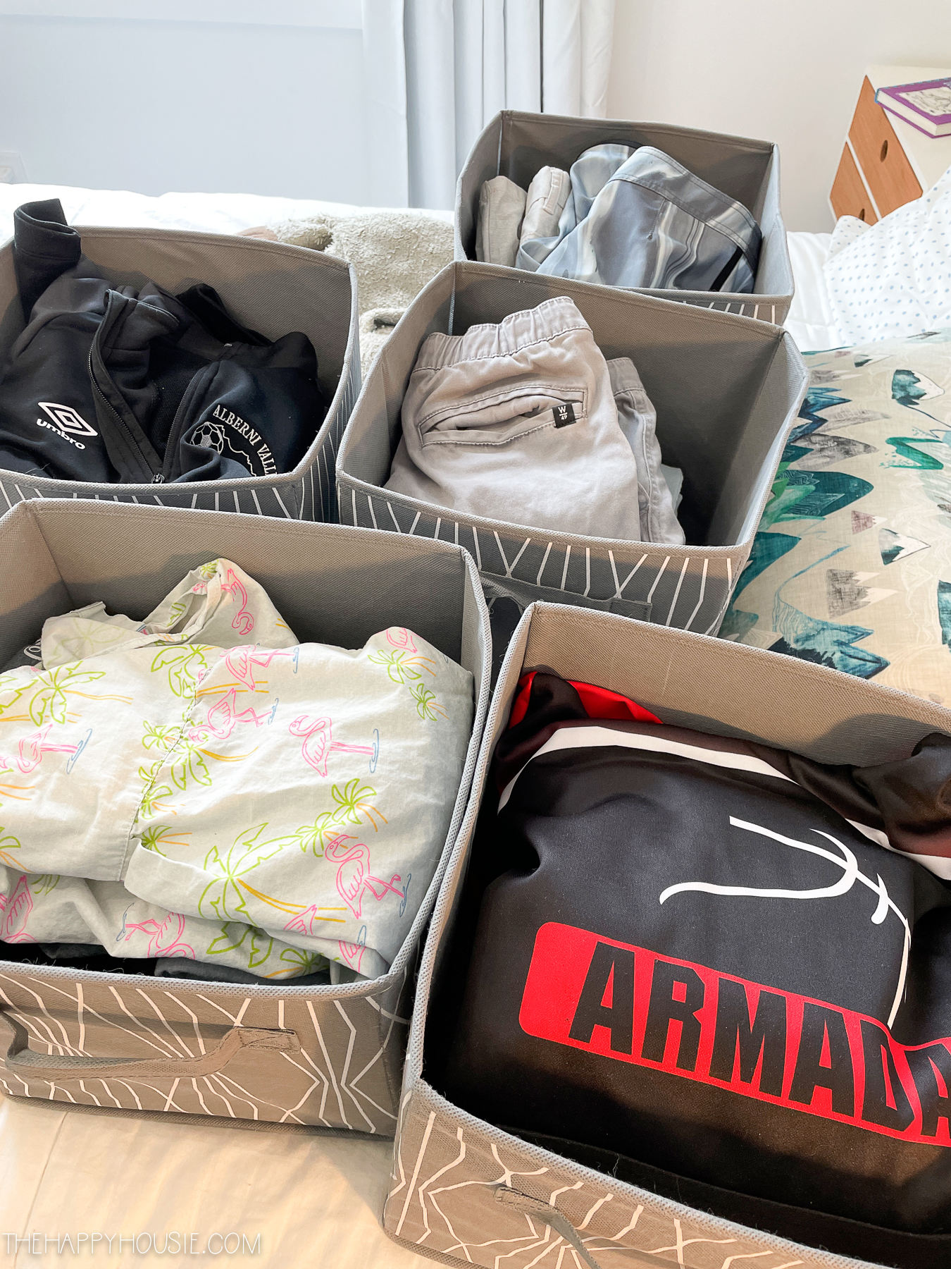 room organization ideas placing next size clothes in bin on upper shelf