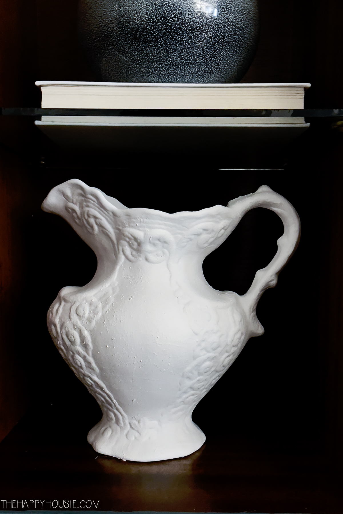 White pitcher with lots of detail.