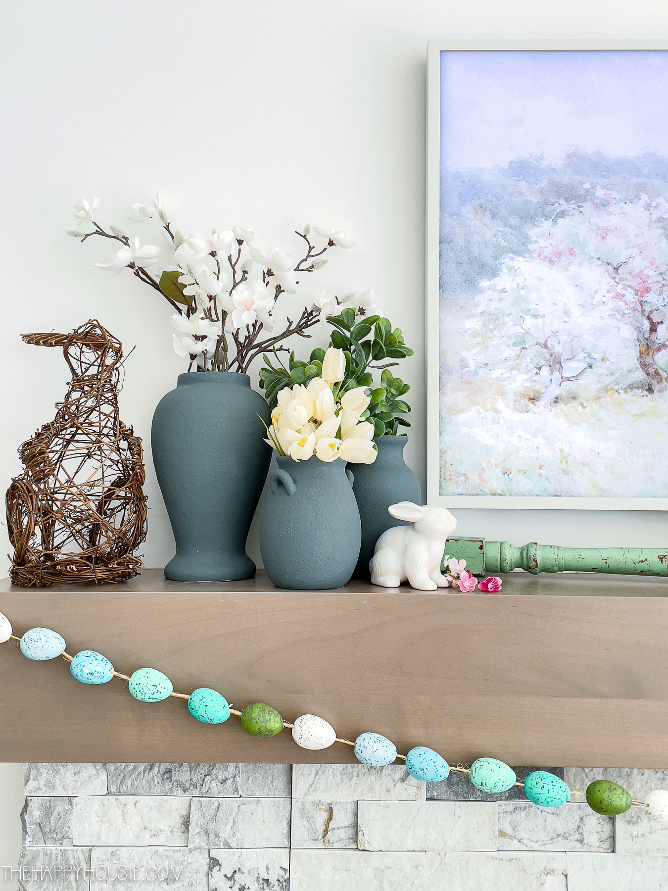 Easter mantel decor with a wicker bunny and egg garland