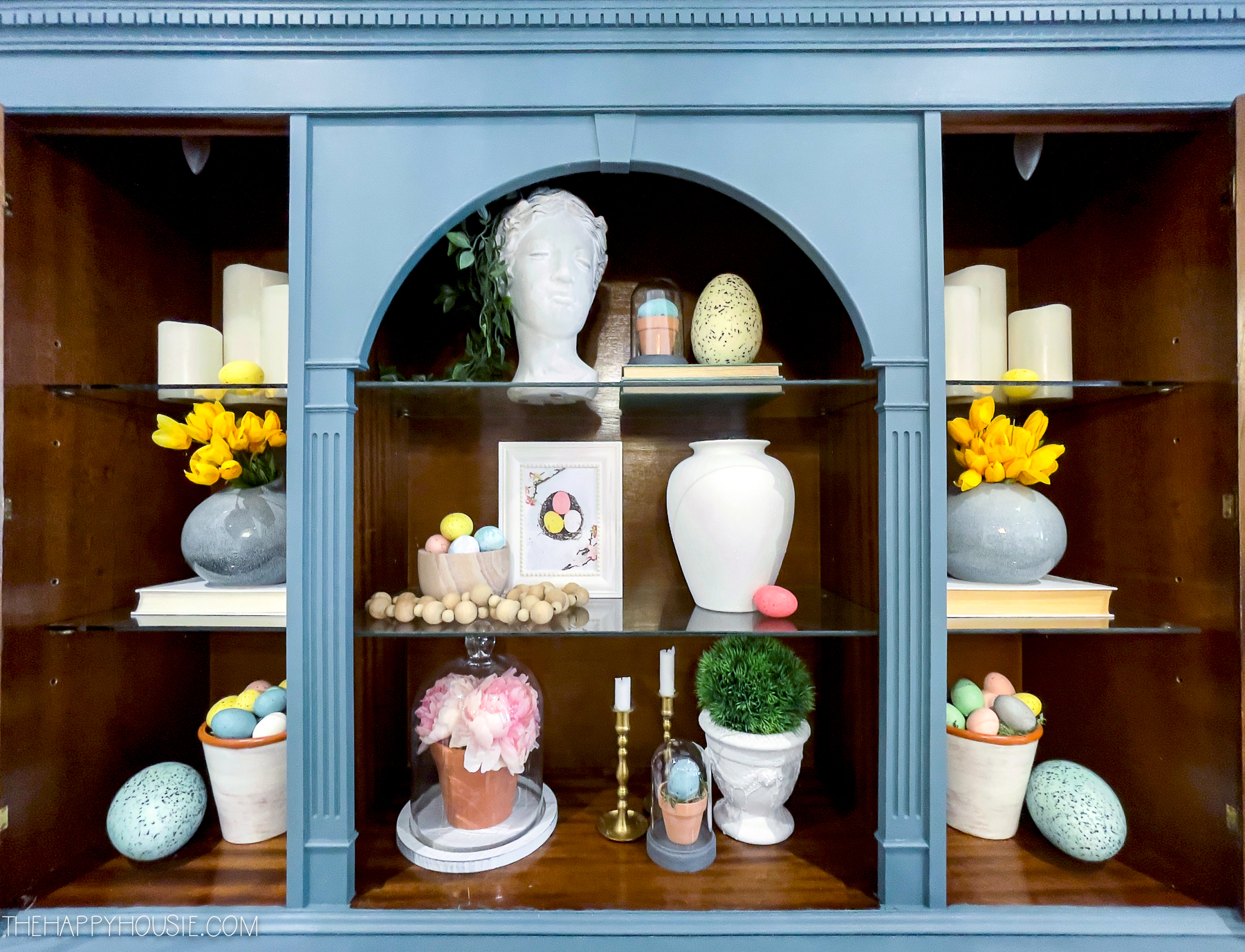 spring decor ideas in the dining room displayed on a decorative hutch
