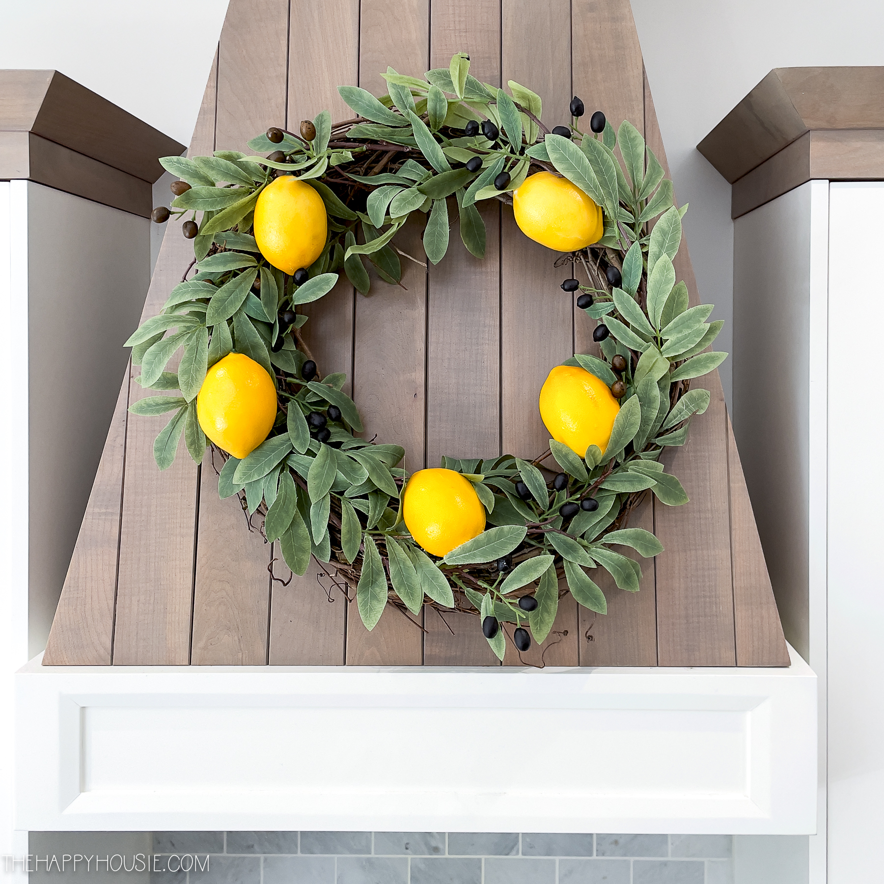 an olive branch and lemon spring kitchen wreath