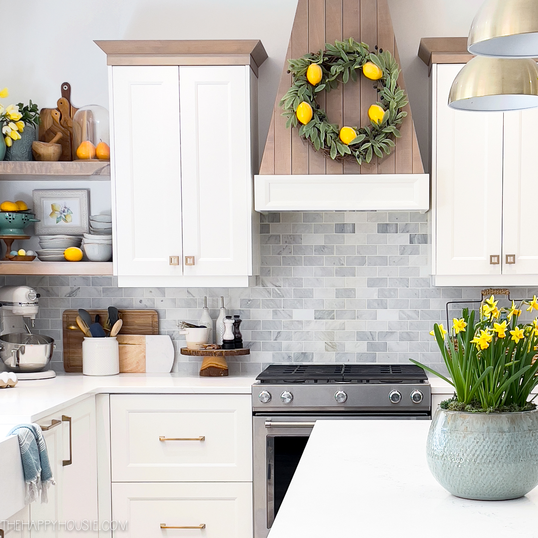 a spring kitchen with pops of yellow featuring a lemon kitchen wreath