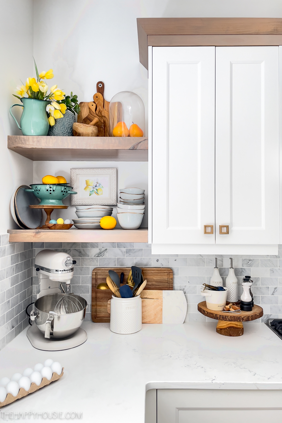 spring kitchen shelves decorated with fresh lemon printables, lemons, and yellow tulips