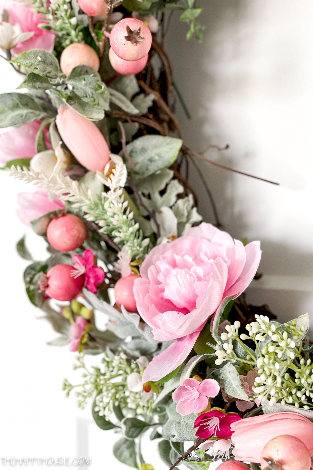 pink peonies and berries on a DIY spring wreath