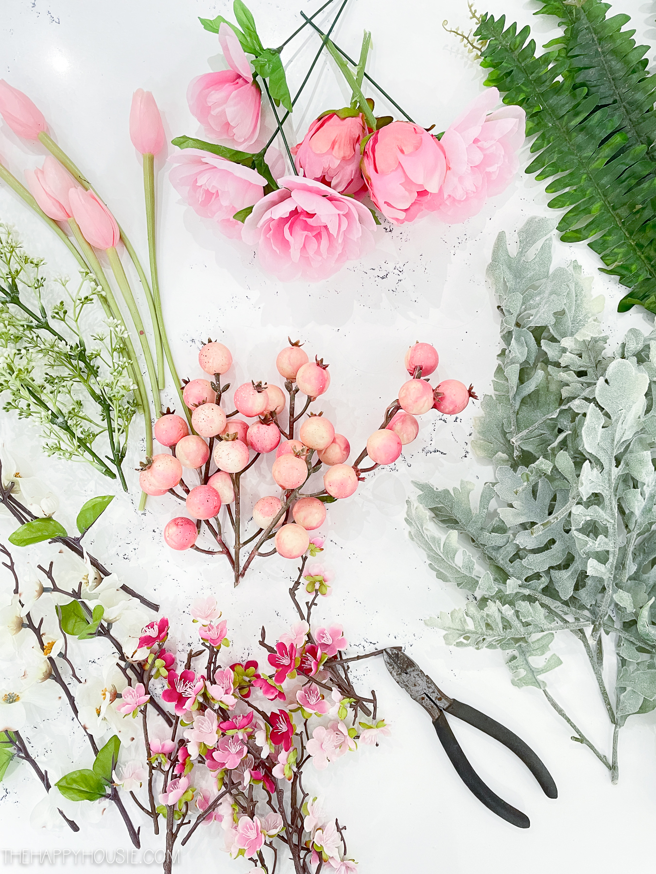 faux greenery and floral branches cut into smaller sections and lengths with wire cutters