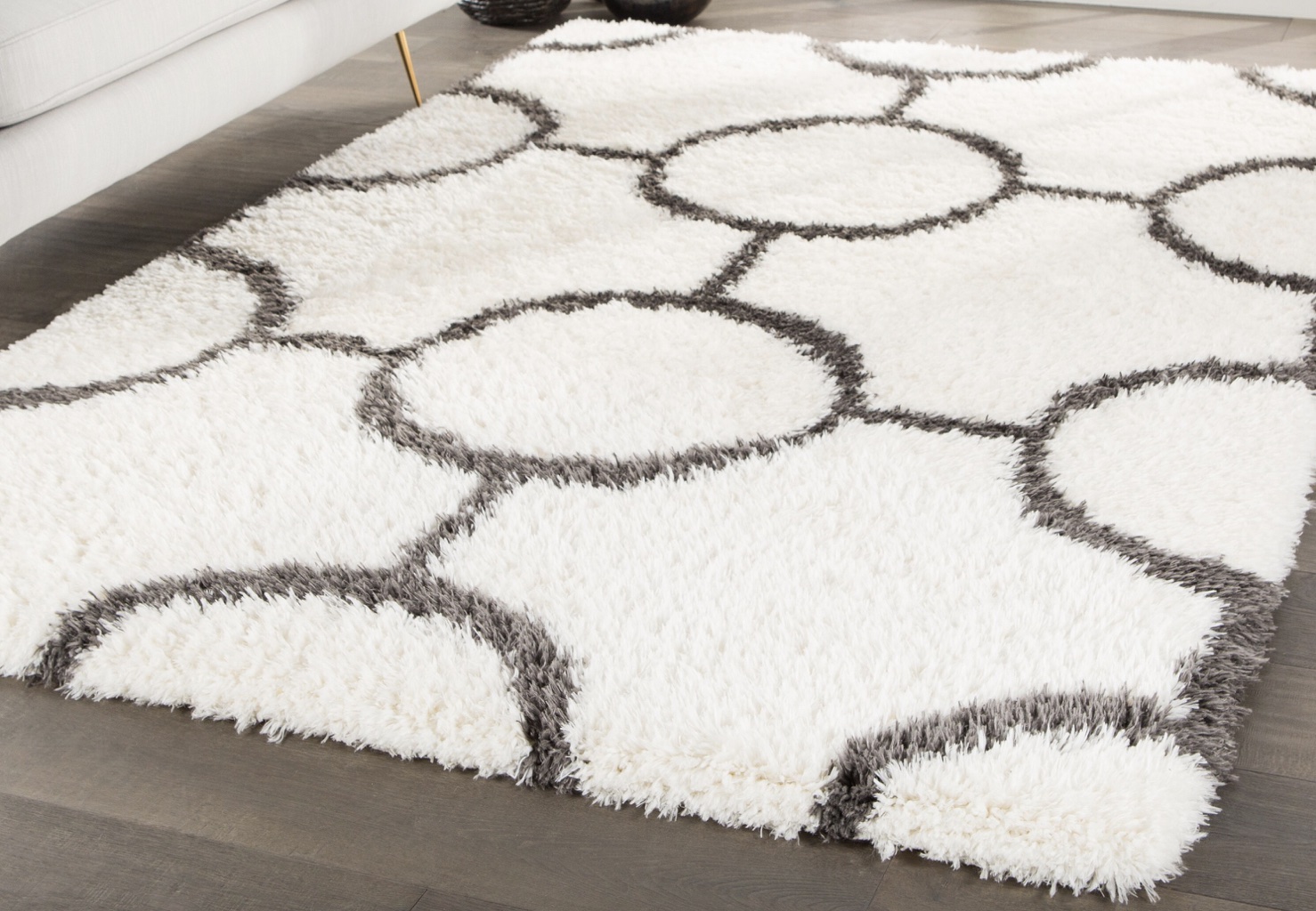 cozy white and charcoal shag rug with a geometric pattern