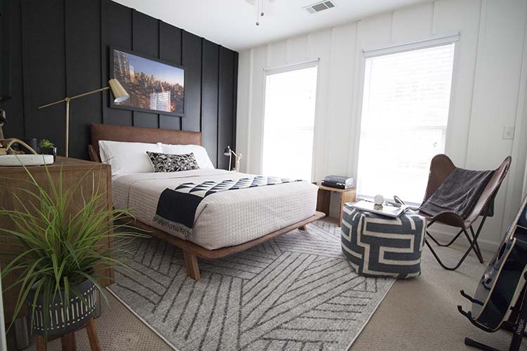 decorated teen boy bedroom with floor to ceiling board and batten wall paneling