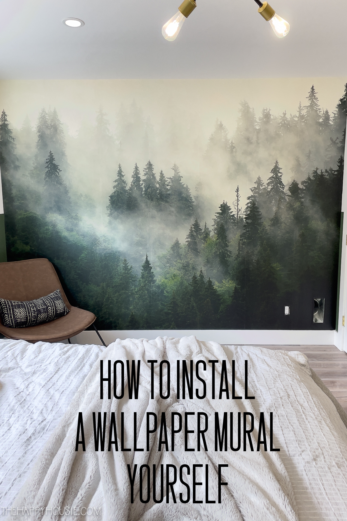 bedroom wall with a misty forest wallpaper mural applied to it