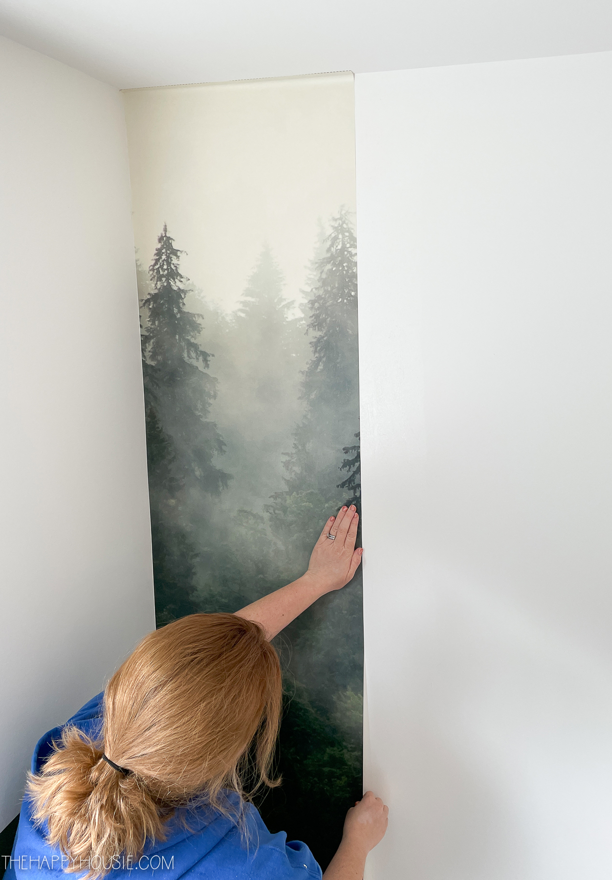 one section of a wallpaper mural being installed