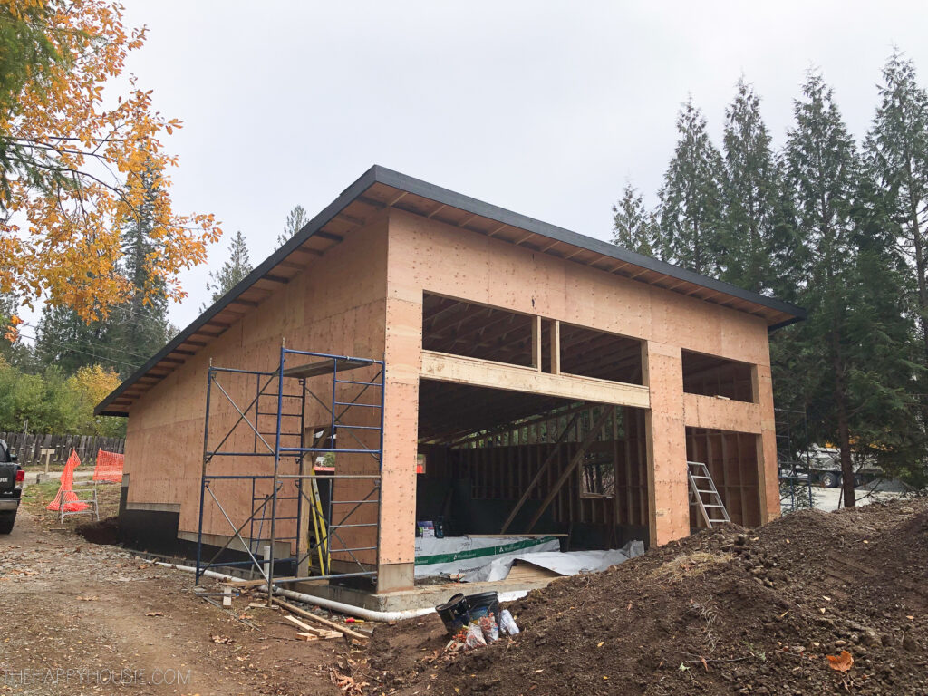 front exterior of modern shed roof garage with suite to be used as a summer lake cabin