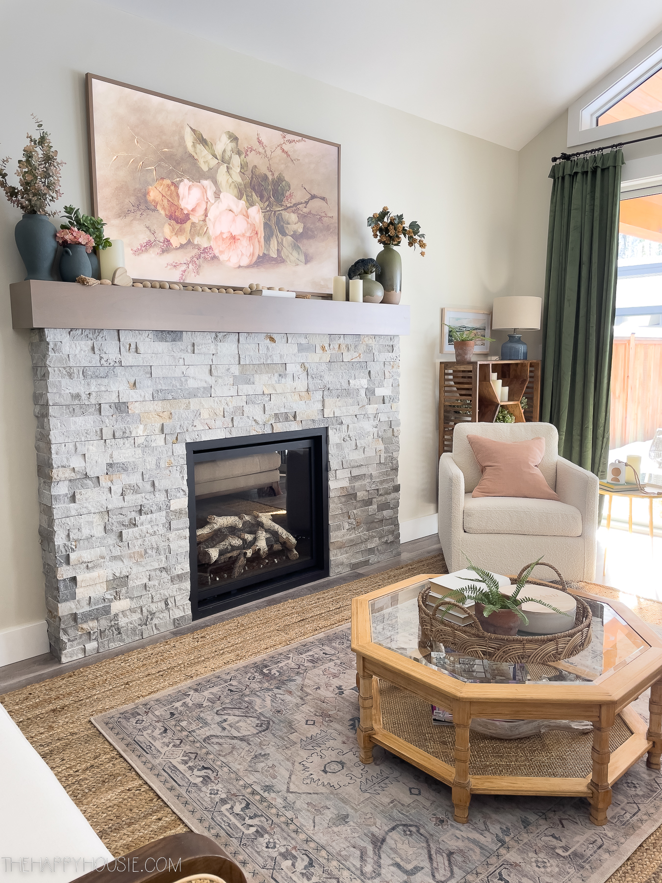 Fireplace on wall in living room space with walls painted Halo, an off-white neutral with green-grey undertones 